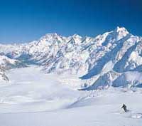Man skiing on glacier.